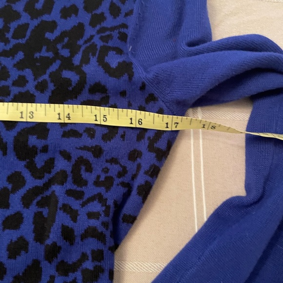 Spense Medium Midi Length knit Dress in a black and royal Blue print. - Picture 8 of 11